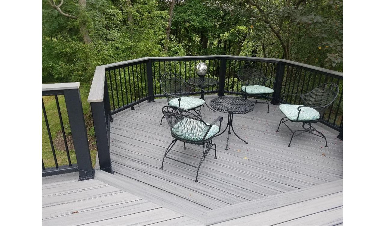A second look at this deck project features a sunken octagon.This black Transcend railing has the black aluminum balusters and a cocktail rail cap in matching Island Mist.