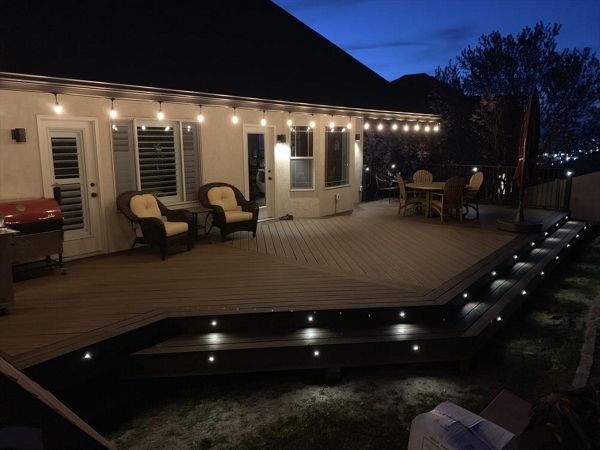 Havana Gold with Spiced Rum boarder. Trex lighting in steps and railing. Utah deck builder