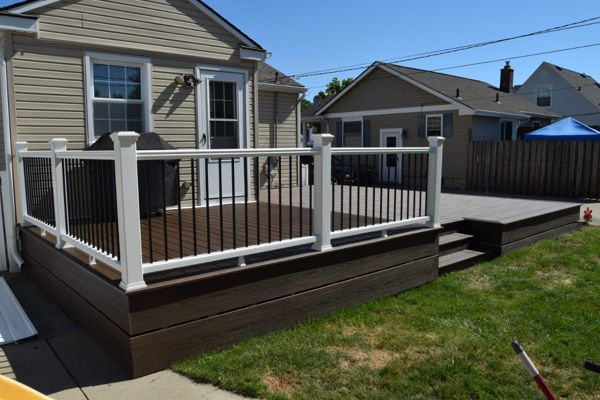 White Transcends Handrail with Black Aluminum Balusters.