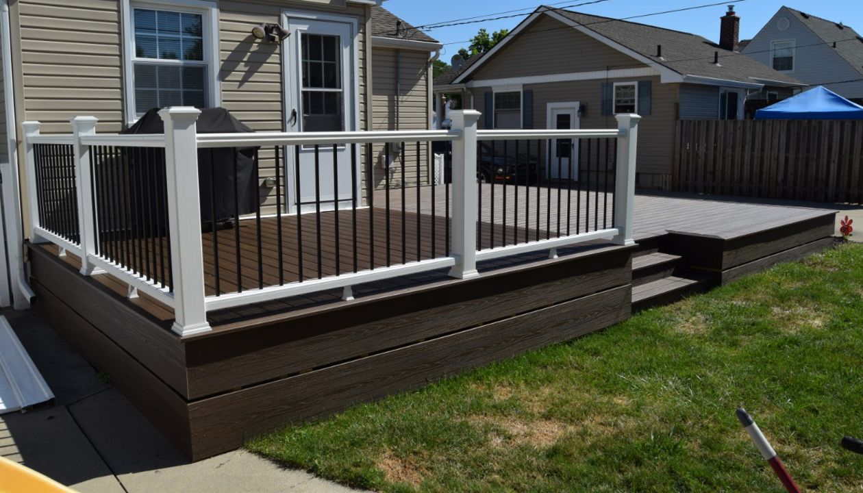 White Transcends Handrail with Black Aluminum Balusters.