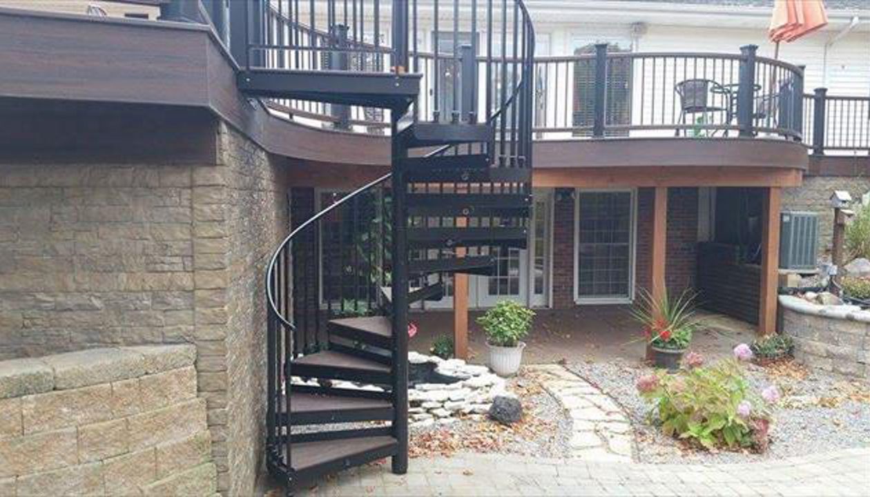Spiral TREX staircase on custom radius deck in 3 tones