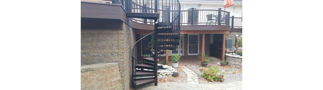Spiral TREX staircase on custom radius deck in 3 tones