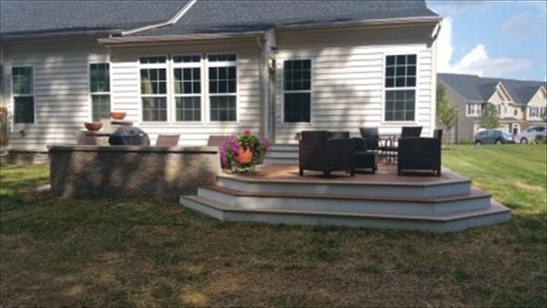 Beautiful platform deck with Trex Transcend Tiki Torch and Rope Swing