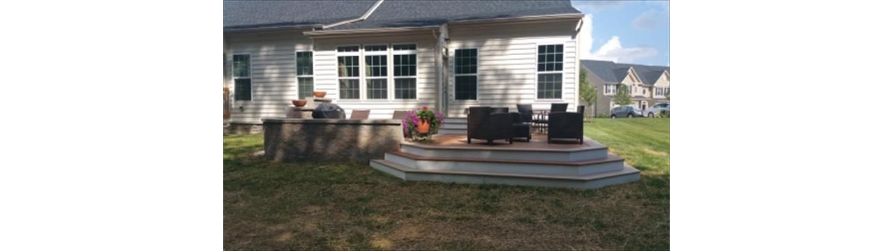 Beautiful platform deck with Trex Transcend Tiki Torch and Rope Swing