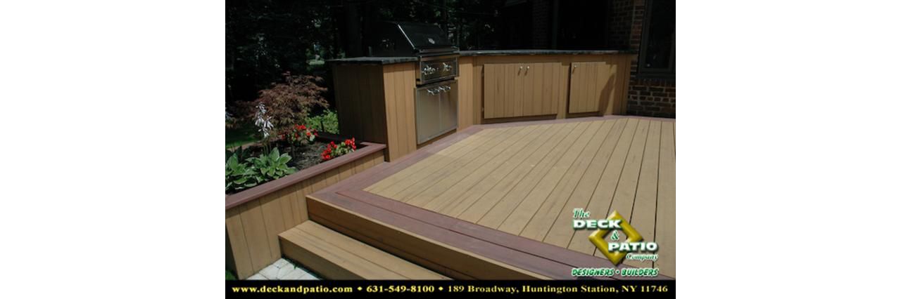 Deck with picture frame border and outdoor kitchen