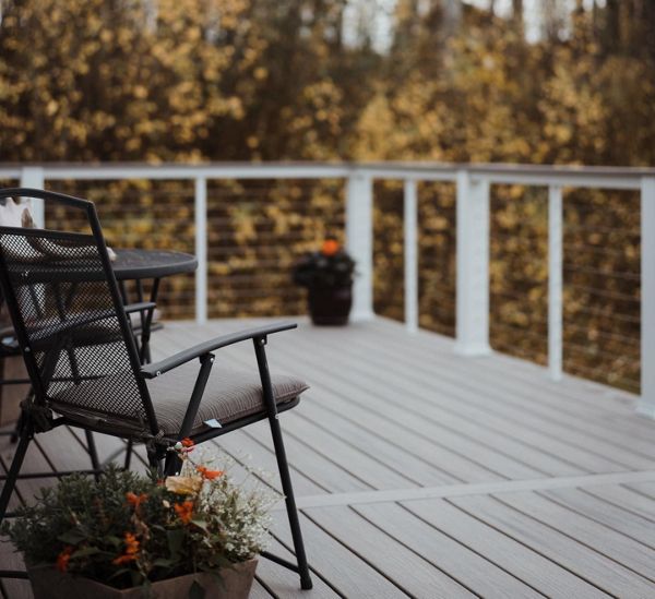 Our Trex decks compliment every season. Trex Enhance Rocky Harbor with White rail components shown.