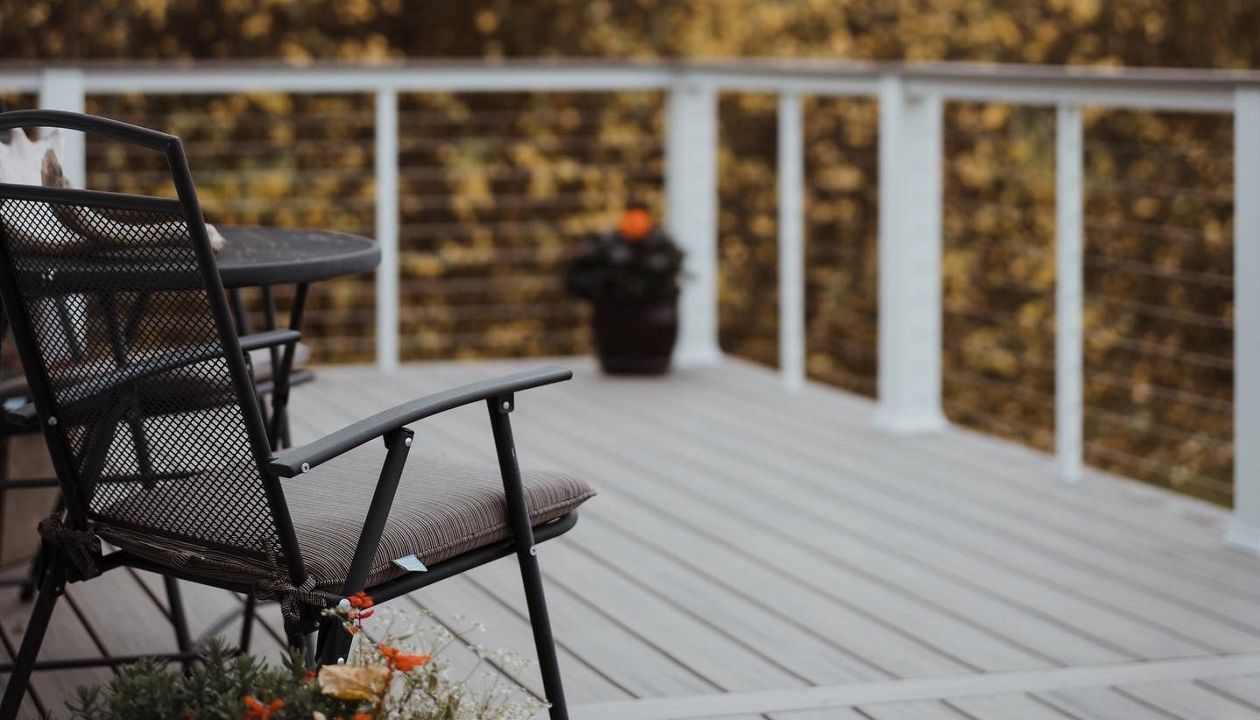 Our Trex decks compliment every season. Trex Enhance Rocky Harbor with White rail components shown.