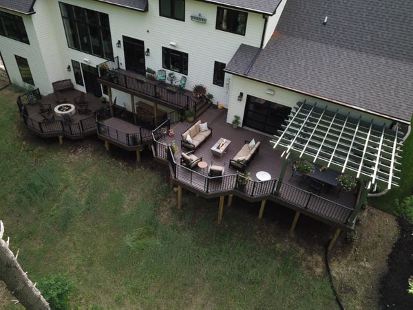 Trex Deck with Trex Signature Rail and Rod Rail, with Cedar Pergola and Trex Furniture and Fire Pit