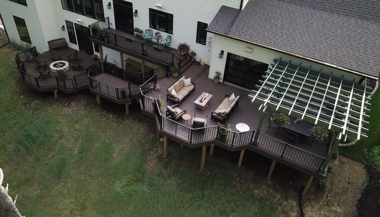 Trex Deck with Trex Signature Rail and Rod Rail, with Cedar Pergola and Trex Furniture and Fire Pit