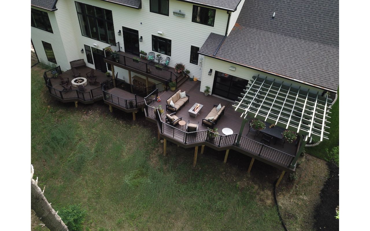 Trex Deck with Trex Signature Rail and Rod Rail, with Cedar Pergola and Trex Furniture and Fire Pit