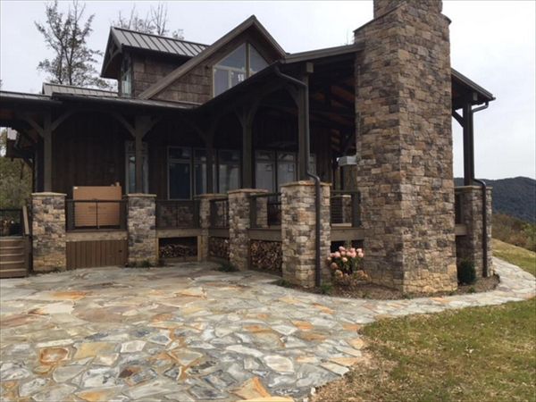 Custom Trex Transcend Havana Gold wood storage areas have both style & function in this custom home.
