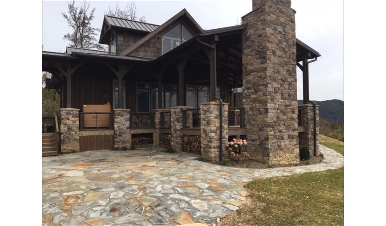 Custom Trex Transcend Havana Gold wood storage areas have both style & function in this custom home.