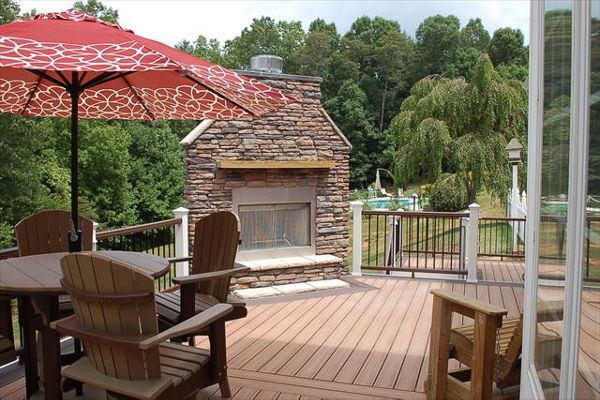 Trex Transcend Tiki Torch decking with double Vintage Lantern picture frame & Trex Transcend Vintage Lantern handrails & great fire place in Mt. Airy, NC.