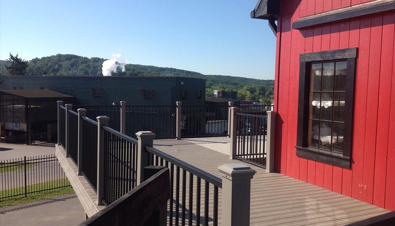 Trex Transcend Deck &amp; Signature Railing in Gravel Path &amp; Black with the Trex Elevations Substructure at The Jim Beam Visitors Center in Bullitt County, Kentucky