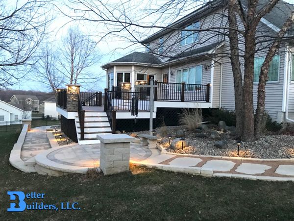 New landscaping and deck with Spiced Rum, Transcend Posts, Signature railing, and Trex lighting - Better Builders of Iowa - Deck project in Johnston, IA