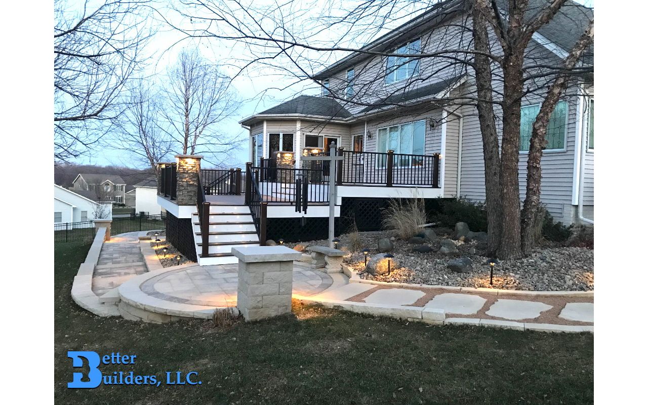 New landscaping and deck with Spiced Rum, Transcend Posts, Signature railing, and Trex lighting - Better Builders of Iowa - Deck project in Johnston, IA