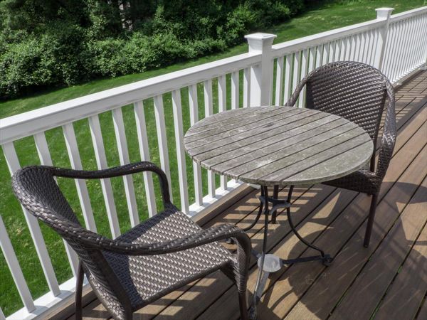 Cantilevered deck with white railings, Redding, CT, Trex Transcend spiced rum