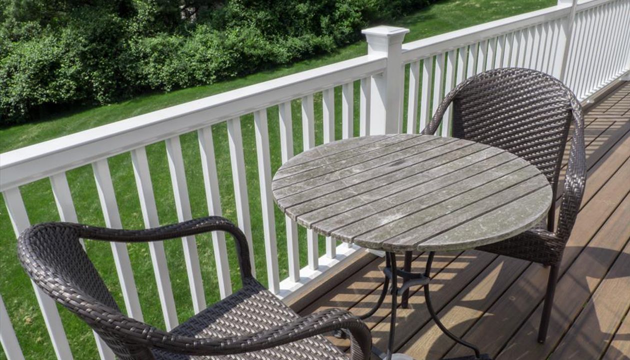 Cantilevered deck with white railings, Redding, CT, Trex Transcend spiced rum