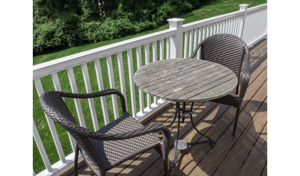 Cantilevered deck with white railings, Redding, CT, Trex Transcend spiced rum
