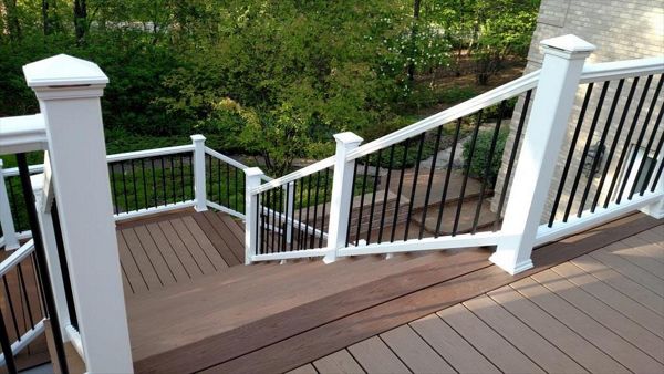 Beach Dune decking with Saddle picture-frame. White railing with black balusters still looks good!
