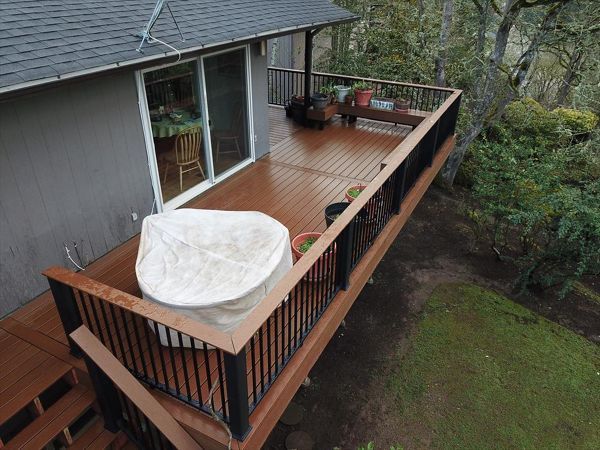 Trex Enhance Basics Deck with Trex Signature Aluminum railing with the “cocktail” rail.