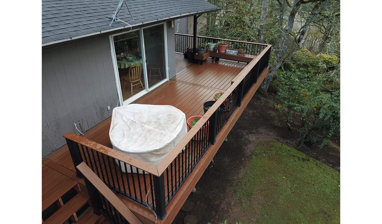 Trex Enhance Basics Deck with Trex Signature Aluminum railing with the “cocktail” rail.
