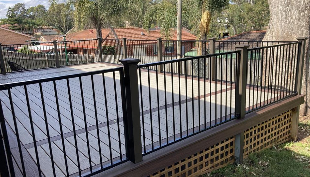 Trex gravel path felid with double lava rock boarder.