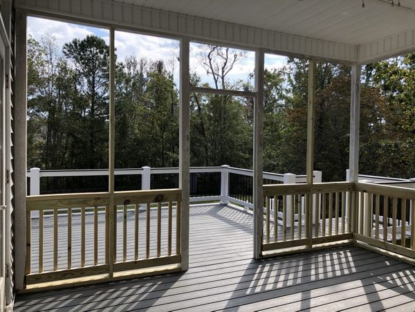 Trex deck flows from porch with Rain Escape below deck