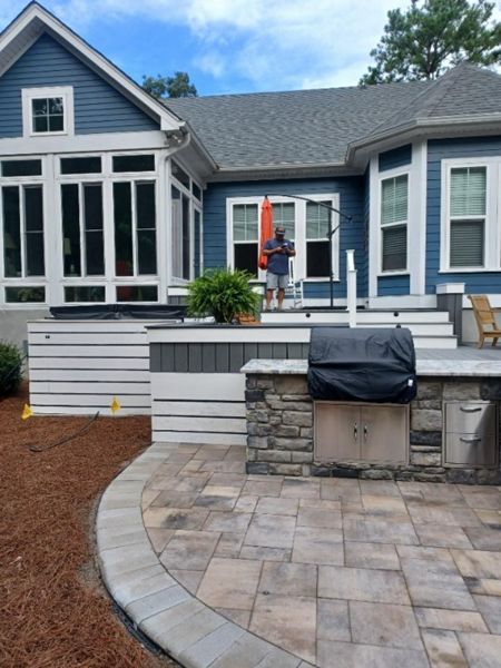 This new deck & hardscape project features Trex Select Pebble Grey decking with a Winchester Grey picture frame for an upgraded visual