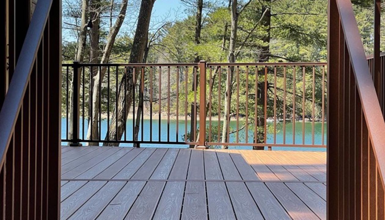 Relax and enjoy the views on your Trex Transcend Tiki Torch deck and Trex Signature Bronze Aluminum Railings! Don't you want a lake view like this?