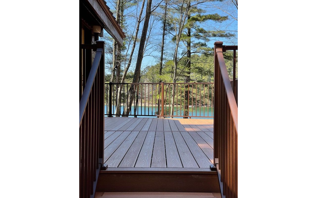 Relax and enjoy the views on your Trex Transcend Tiki Torch deck and Trex Signature Bronze Aluminum Railings! Don't you want a lake view like this?