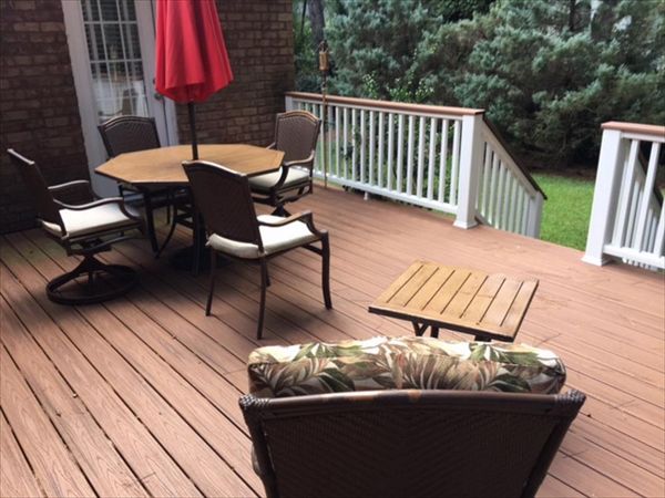 Trex Transcend Tiki Torch deck with Transcend Classic White Tiki Torch cocktail railing is great place to unwind.