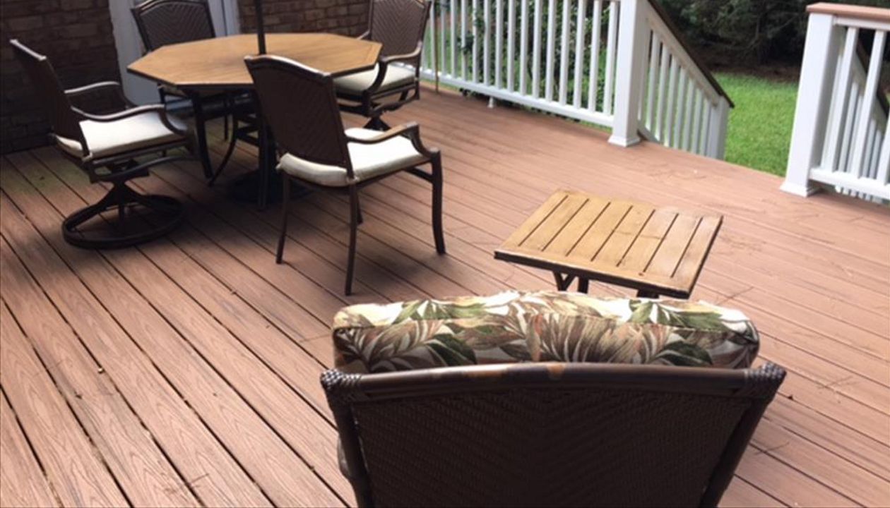 Trex Transcend Tiki Torch deck with Transcend Classic White Tiki Torch cocktail railing is great place to unwind.