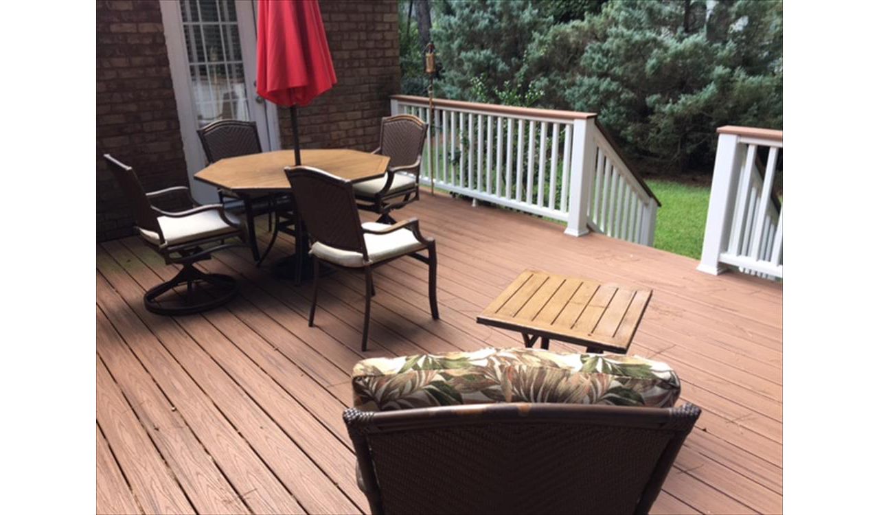 Trex Transcend Tiki Torch deck with Transcend Classic White Tiki Torch cocktail railing is great place to unwind.
