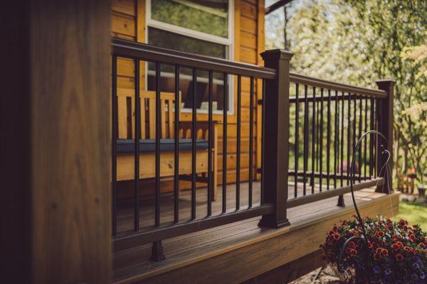 Trex Transcend Havana Gold paired Vintage Lantern rail system compliment this honey-colored home.