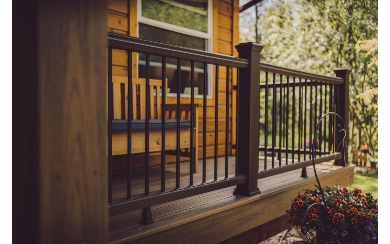 Trex Transcend Havana Gold paired Vintage Lantern rail system compliment this honey-colored home.