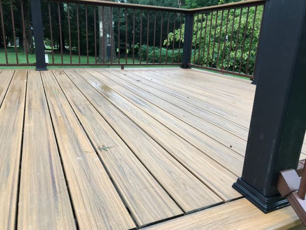 Tropical Havan Gold decking with signature bronze railing and black posts.