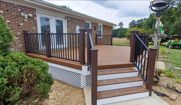 Great new Trex Enhance Basics Saddle deck with Signature Black Handrails and Vintage Lantern Posts in Dunn, NC