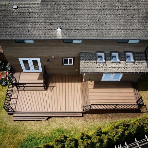 Toasted Sand field and risers with Spiced Rum bordering, lighting package, and aluminum railings.
