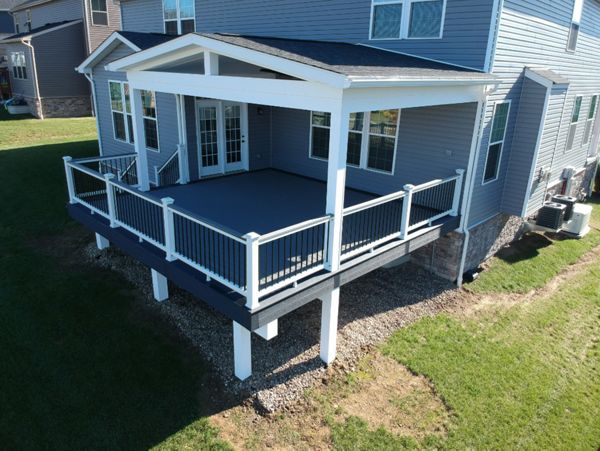 Partially covered Pebble Gray and Winchester Gray deck. Select rail with Island Mist 2x4 cocktail rail top