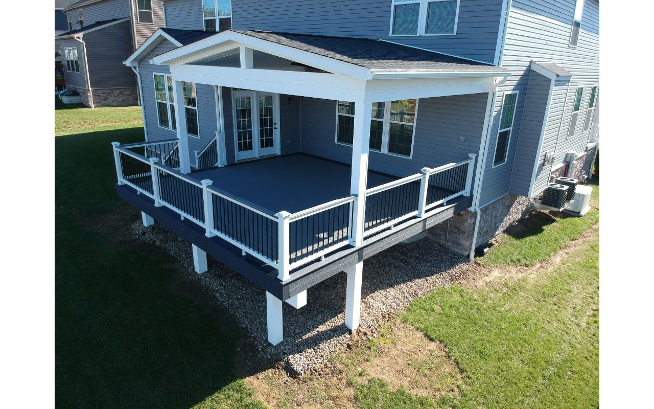 Partially covered Pebble Gray and Winchester Gray deck. Select rail with Island Mist 2x4 cocktail rail top