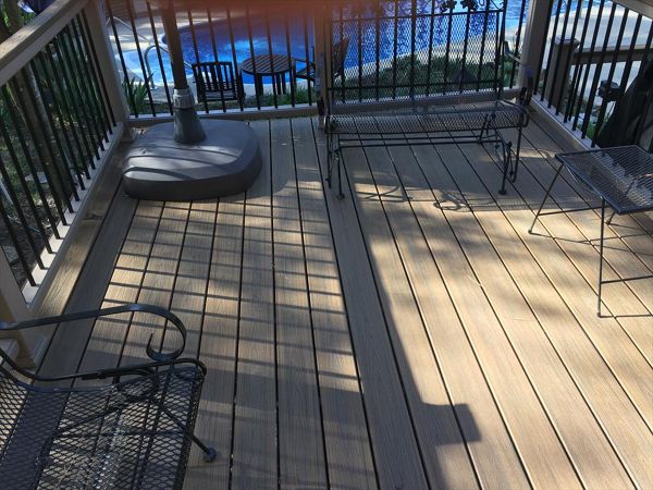 Trex Transcend Havana Gold deck give a great place to spend a warm summer day under an umbrella