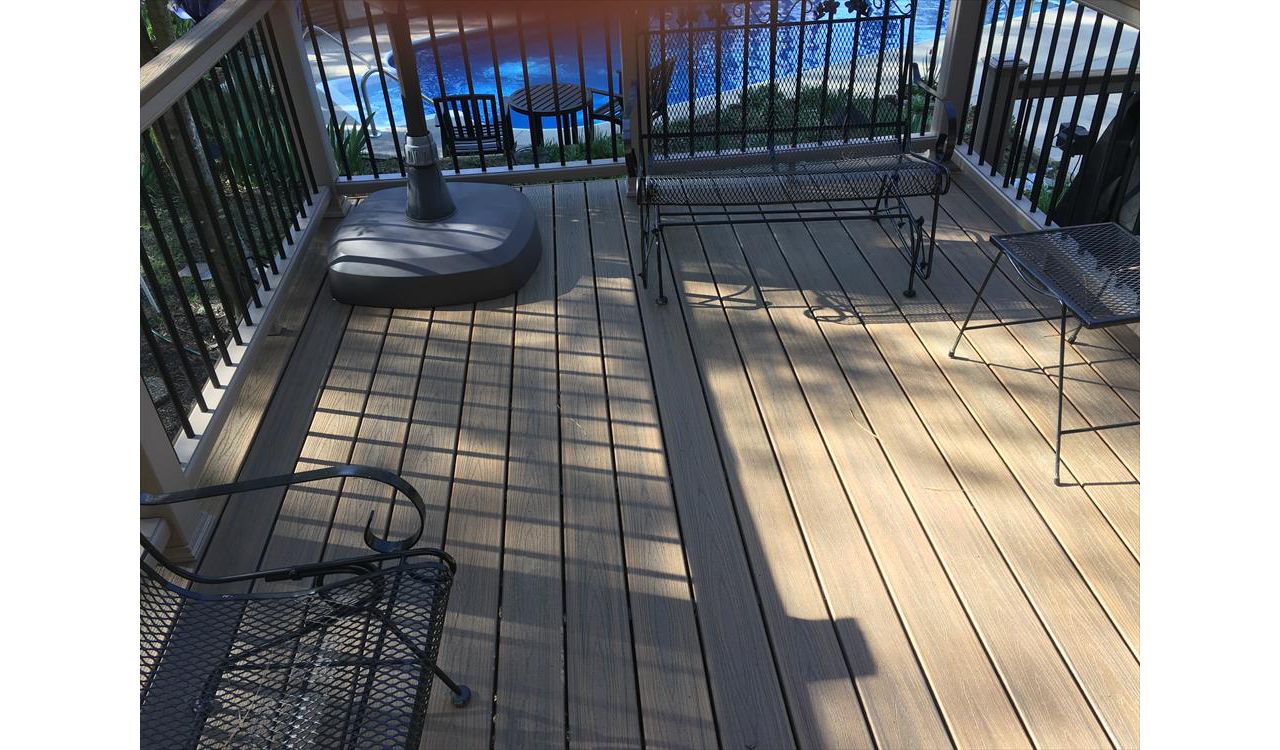 Trex Transcend Havana Gold deck give a great place to spend a warm summer day under an umbrella
