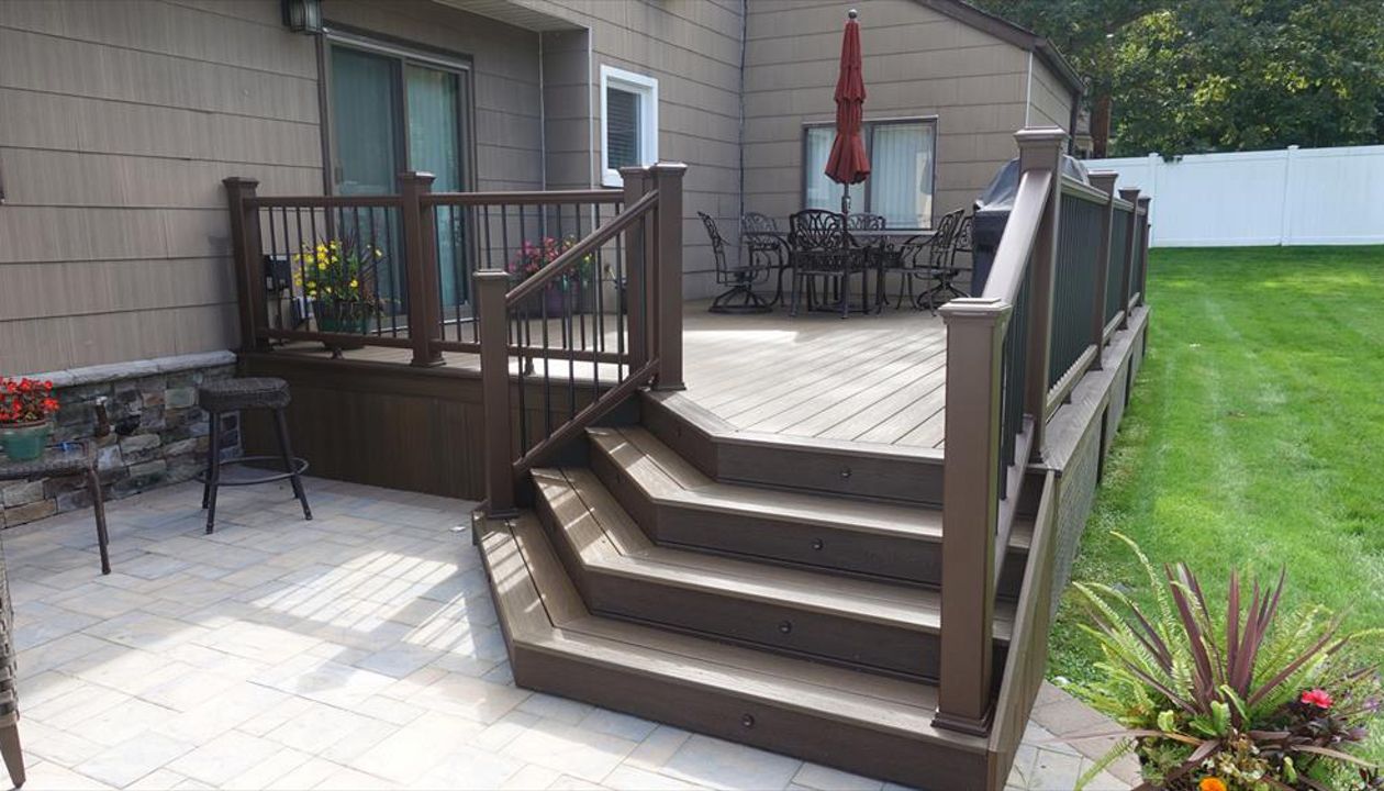 Dix hills trex spiced rum deck with  Cambridge patio