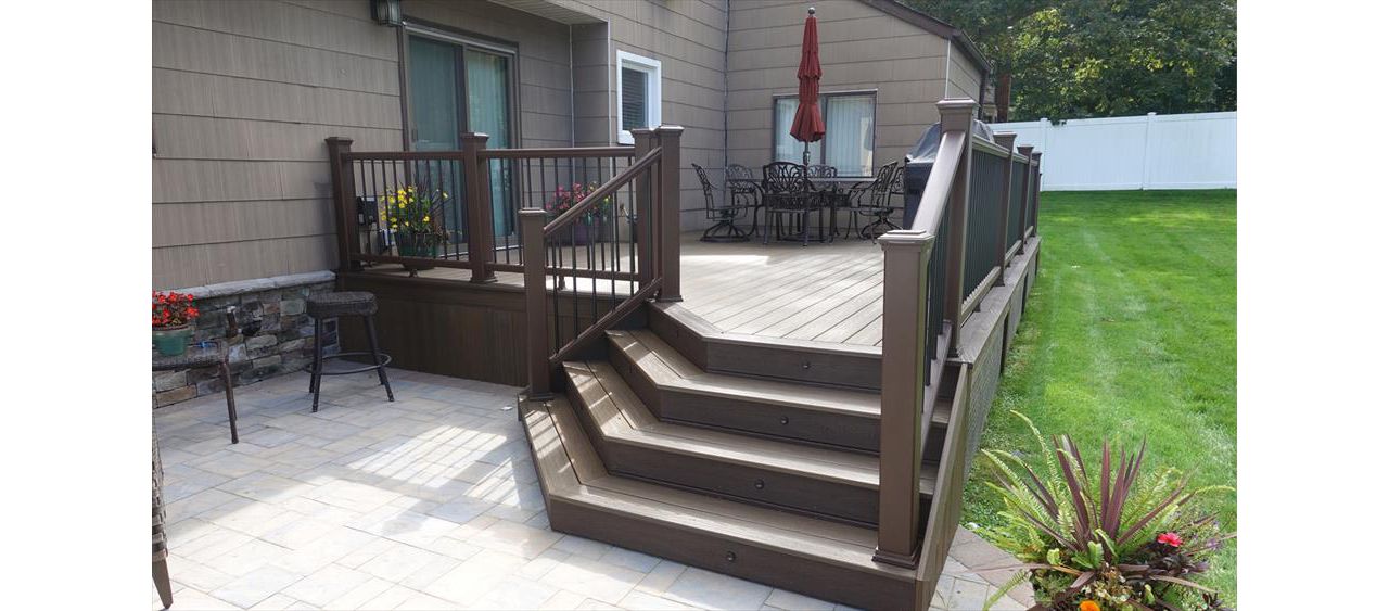 Dix hills trex spiced rum deck with  Cambridge patio