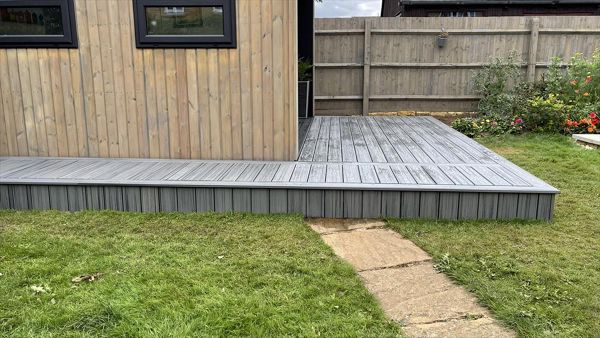 Just finished in little bought on Northampton, Love this rap around deck to the new out building built in trex transcend composite decking in the popular island mist colour just finishes it off lovely.