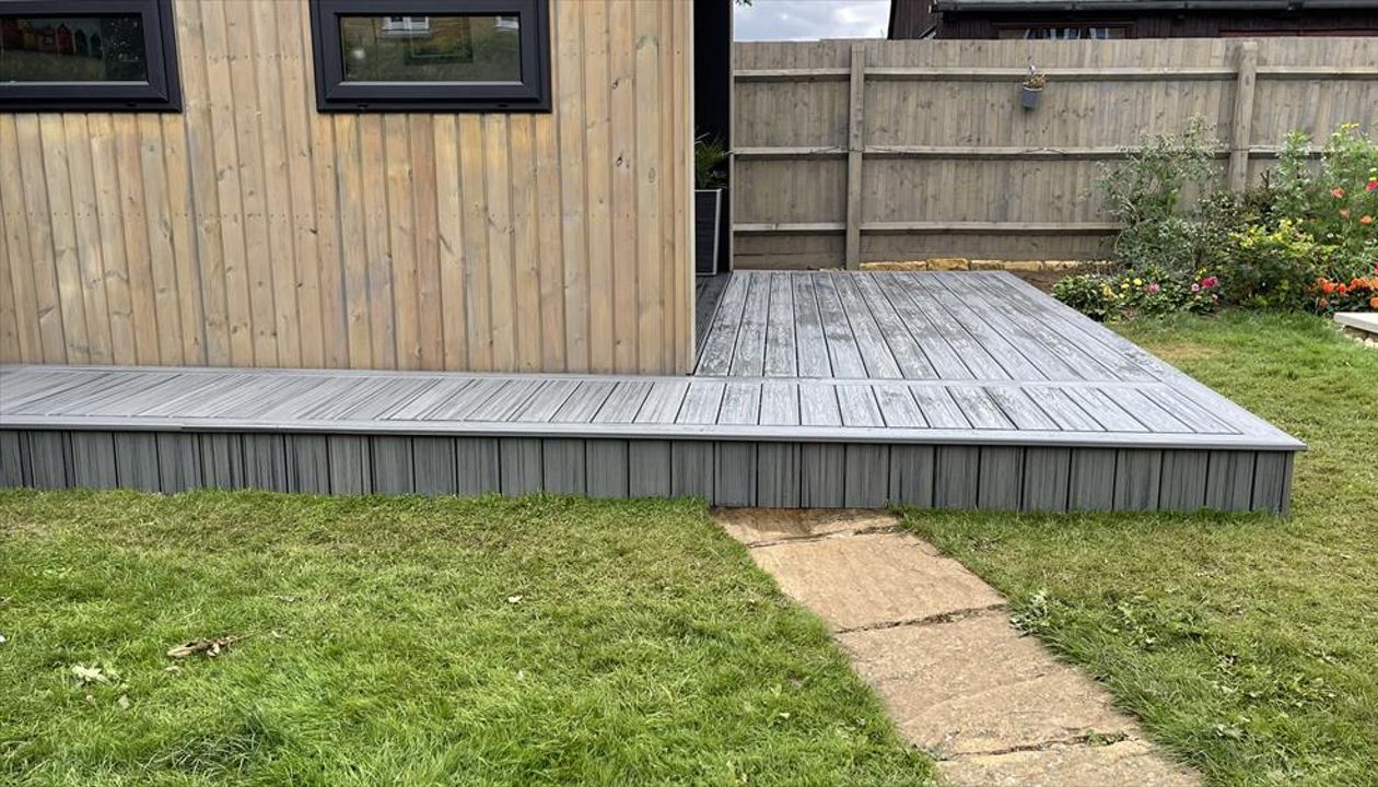 Just finished in little bought on Northampton, Love this rap around deck to the new out building built in trex transcend composite decking in the popular island mist colour just finishes it off lovely.