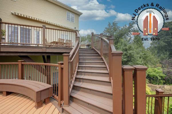 Custom Curved stairway leading to a round deck with curved benches.