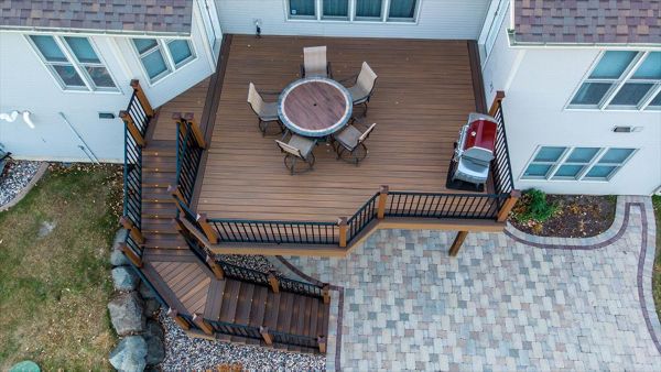 This deck has Trex elevations framing and Trex Transcend decking. Add in the Trex LED lights and this is now the new dining room.