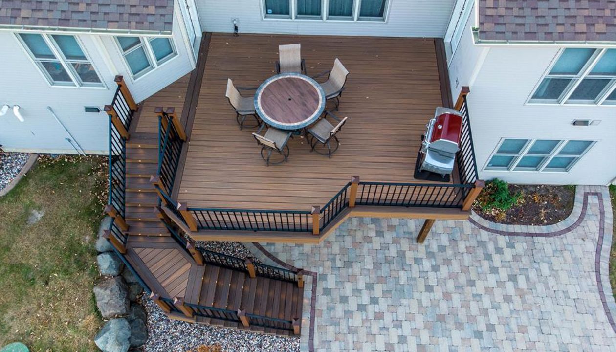 This deck has Trex elevations framing and Trex Transcend decking. Add in the Trex LED lights and this is now the new dining room.